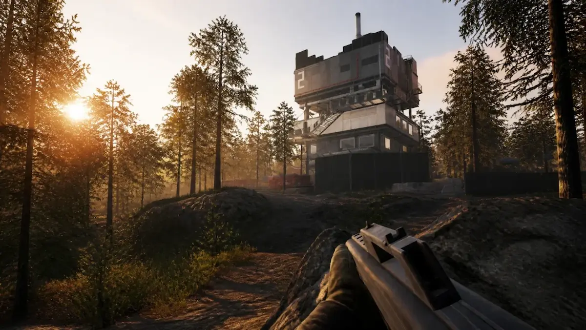 In-game view of a numbered Wardogs tower on Bakurani, approached through the forest at sunrise