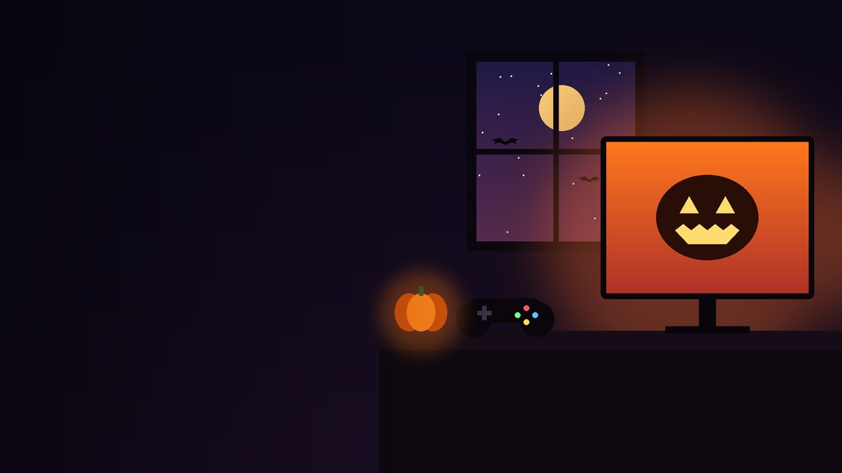 Setup de gaming de Halloween cu monitor și dovleac
